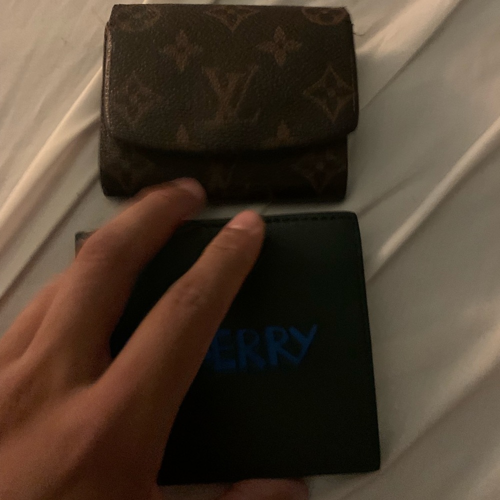Brand new Burberry wallet and used Louis Vuitton wallet